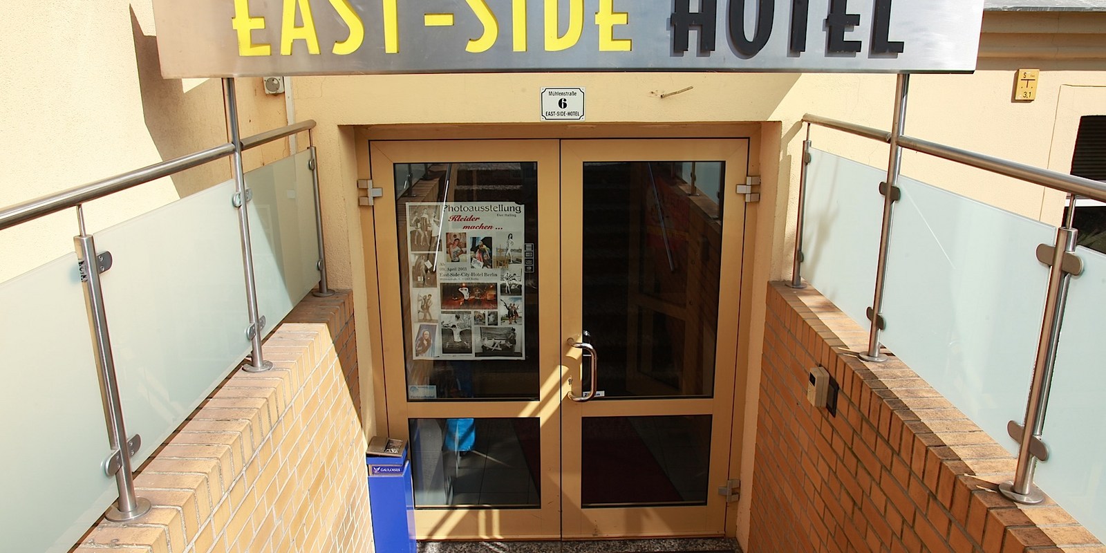Entrance under the EAST-SIDE HOTEL sign